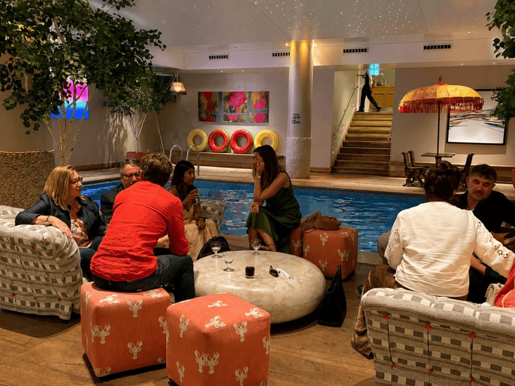 Guests sitting by the pool