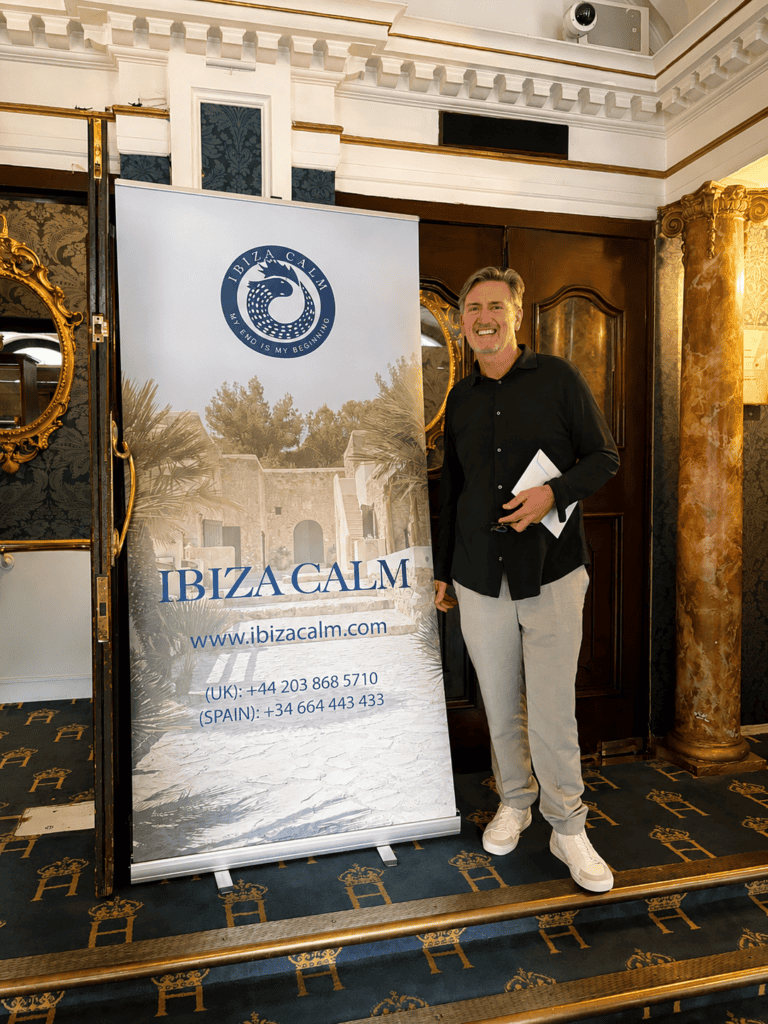 John M standing by the Ibiza Calm banner